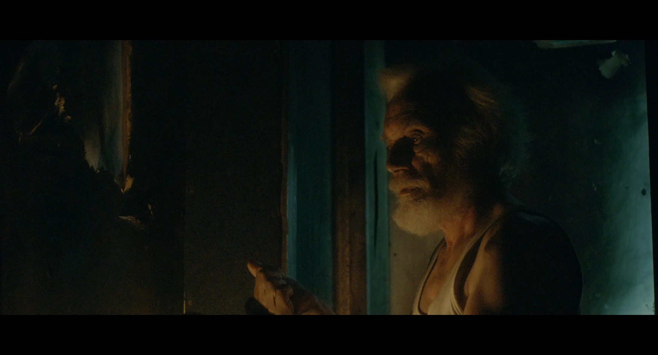 Selman Jusufi in the burnt-out ruins of his house