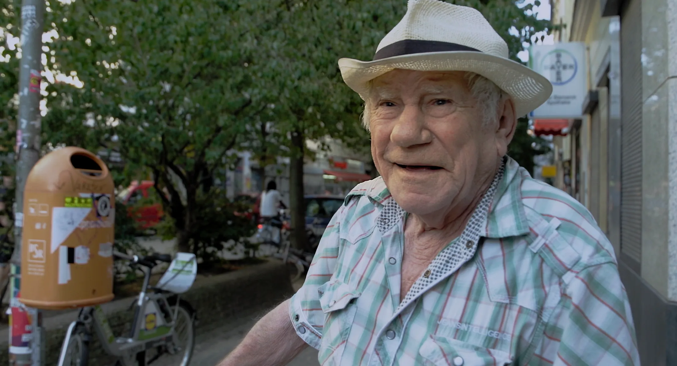 An old man takes a stroll around the neighbourhood